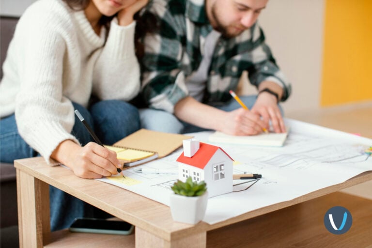 Couple creating a plan for starting their rental property business